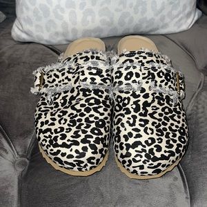 Leopard print slipper shoe.